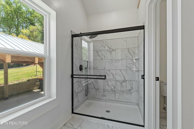 full bathroom with toilet, baseboards, a shower stall, and marble finish floor
