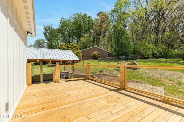 deck featuring a yard and fence
