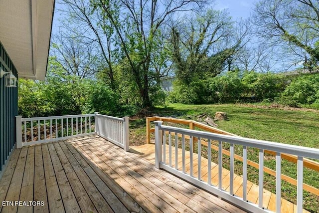 wooden deck with a yard