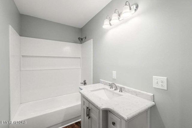 full bathroom with vanity and shower / tub combination