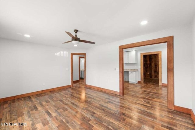 unfurnished room with baseboards, a ceiling fan, wood finished floors, and recessed lighting