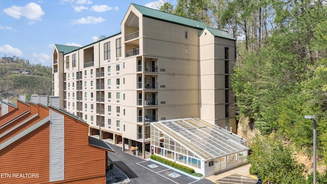 view of property with uncovered parking
