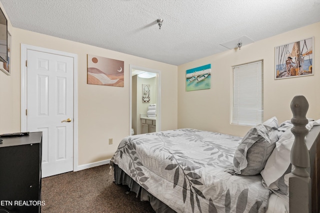 carpeted bedroom with a textured ceiling