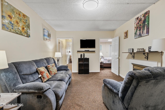 living area with carpet, a textured ceiling, and baseboards