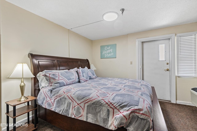 bedroom with baseboards and carpet floors