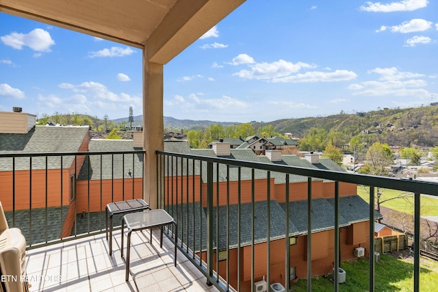 balcony featuring central air condition unit and a mountain view