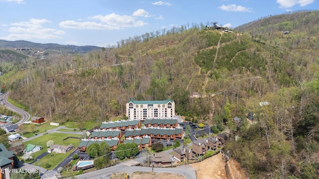 bird's eye view with a forest view and a mountain view