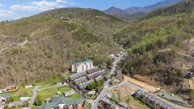 aerial view featuring a mountain view and a wooded view