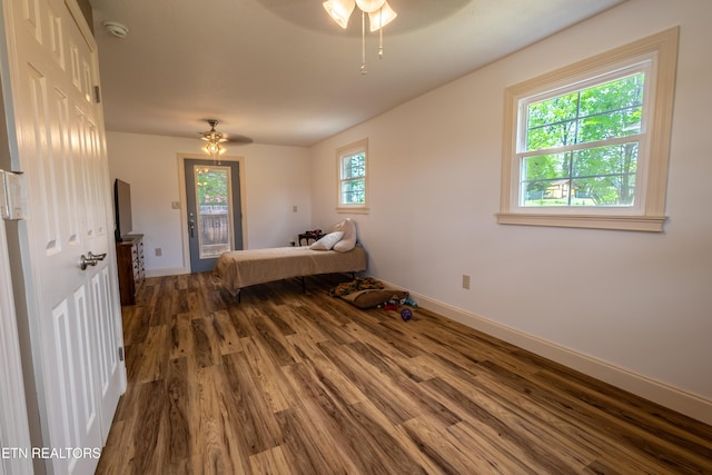 537 Wilson St, Newport, TN 37821 - bedroom featuring baseboards, a ceiling fan, wood finished floors, and access to outside