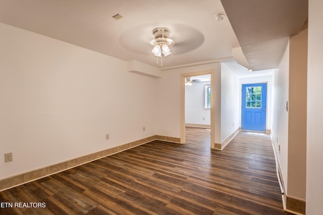 537 Wilson St, Newport, TN 37821 - unfurnished room with baseboards, dark wood-type flooring, and ceiling fan