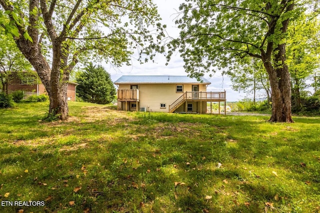 537 Wilson St, Newport, TN 37821 - back of house with a yard, metal roof, stairs, and a deck