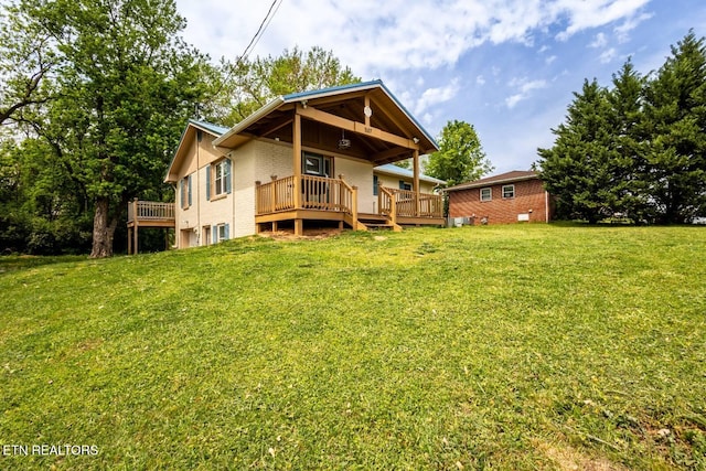 537 Wilson St, Newport, TN 37821 - rear view of house featuring brick siding, a yard, and a deck