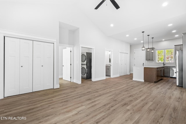 103 E Main St, Englewood, TN 37329 - kitchen with a center island, open floor plan, stacked washer and clothes dryer, freestanding refrigerator, and a ceiling fan