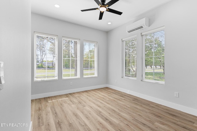 103 E Main St, Englewood, TN 37329 - spare room with baseboards, a ceiling fan, wood finished floors, and a wall unit AC