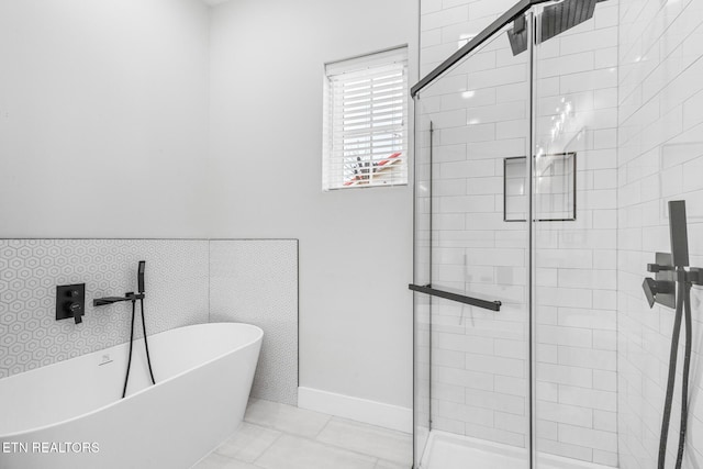 103 E Main St, Englewood, TN 37329 - full bath featuring a freestanding bath, tile patterned flooring, and a stall shower