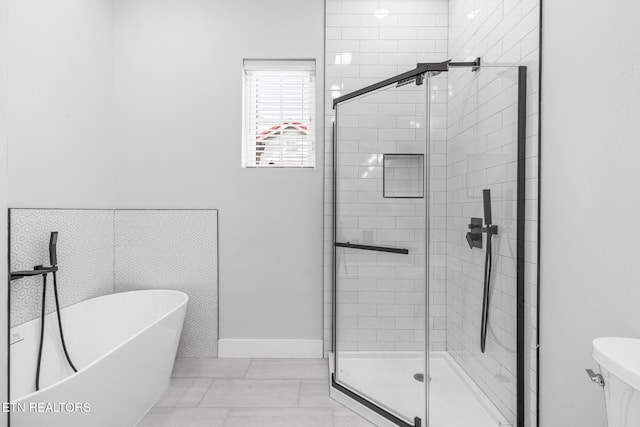 103 E Main St, Englewood, TN 37329 - bathroom featuring a shower stall, a freestanding tub, and toilet