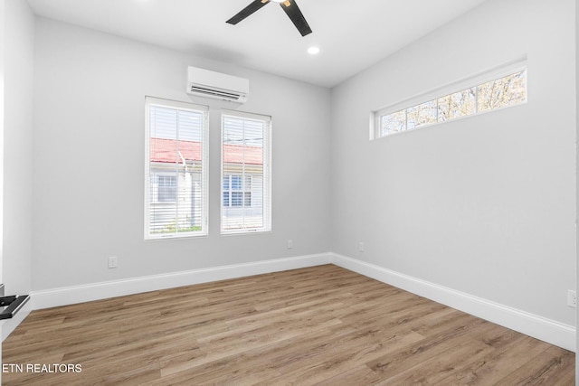 103 E Main St, Englewood, TN 37329 - unfurnished room with light wood-style flooring, baseboards, a wall unit AC, and ceiling fan