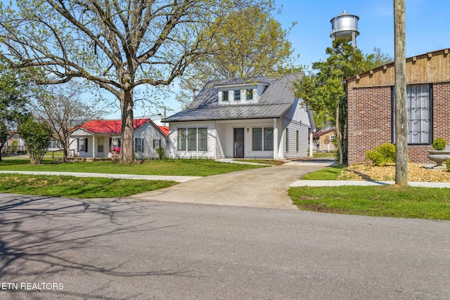 103 E Main St, Englewood, TN 37329 - bungalow-style house featuring a front yard and driveway