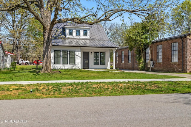 103 E Main St, Englewood, TN 37329 - bungalow-style home with a front lawn, metal roof, and a standing seam roof