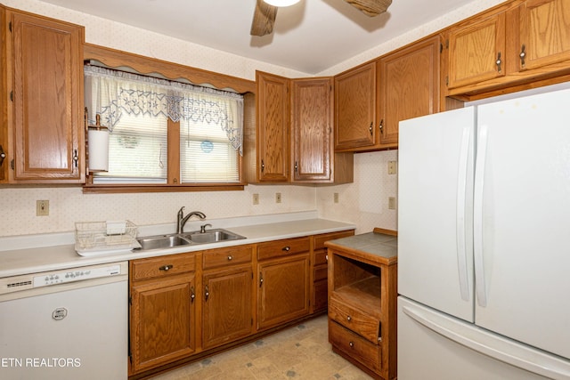 285 Telford St, Alcoa, TN 37701 - kitchen featuring light countertops, brown cabinets, a sink, and white appliances