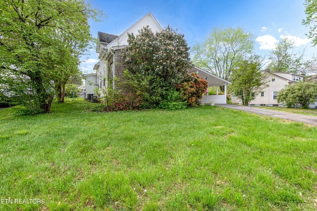 285 Telford St, Alcoa, TN 37701 - view of property hidden behind natural elements featuring a front yard and driveway