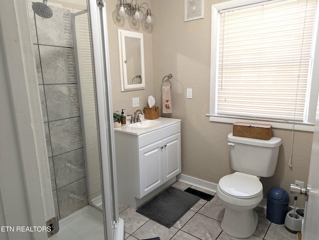 bathroom with visible vents, toilet, a shower stall, vanity, and tile patterned flooring