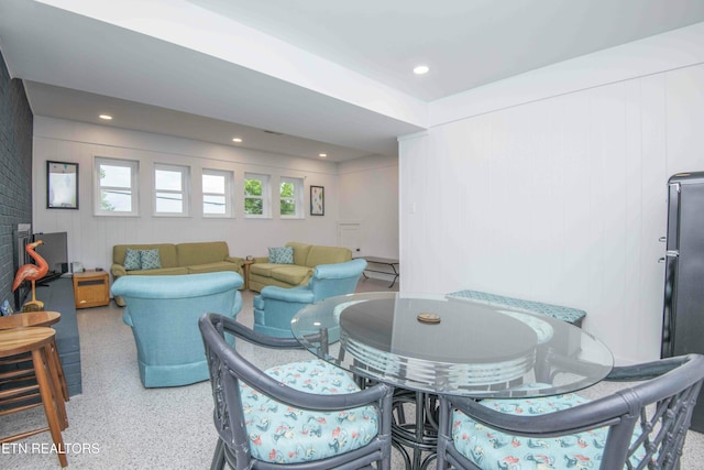 living room featuring speckled floor and recessed lighting