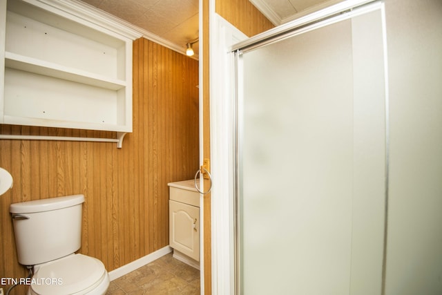 full bathroom featuring a shower stall, wooden walls, and toilet