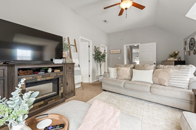 7300 Slippery Rock Ln, Knoxville, TN 37931 - carpeted living room featuring lofted ceiling, a ceiling fan, visible vents, and a fireplace