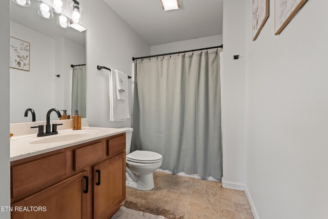 7300 Slippery Rock Ln, Knoxville, TN 37931 - bathroom with stone finish flooring, toilet, and vanity