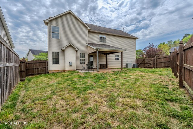 7300 Slippery Rock Ln, Knoxville, TN 37931 - rear view of house with a lawn, a patio area, a fenced backyard, and cooling unit