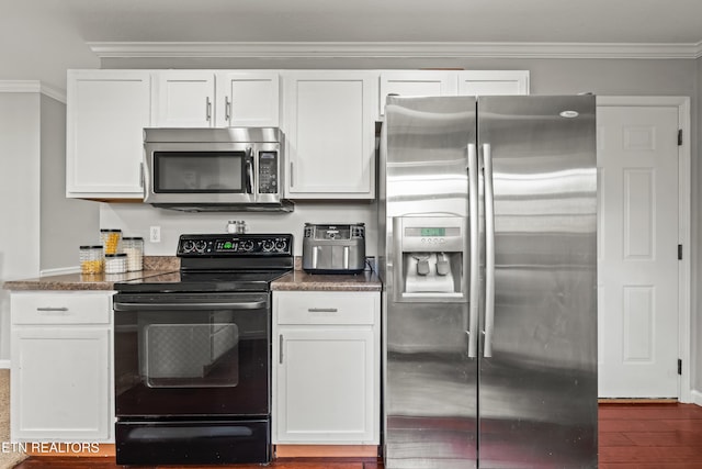 7300 Slippery Rock Ln, Knoxville, TN 37931 - kitchen with wood finished floors, ornamental molding, baseboards, appliances with stainless steel finishes, and white cabinetry