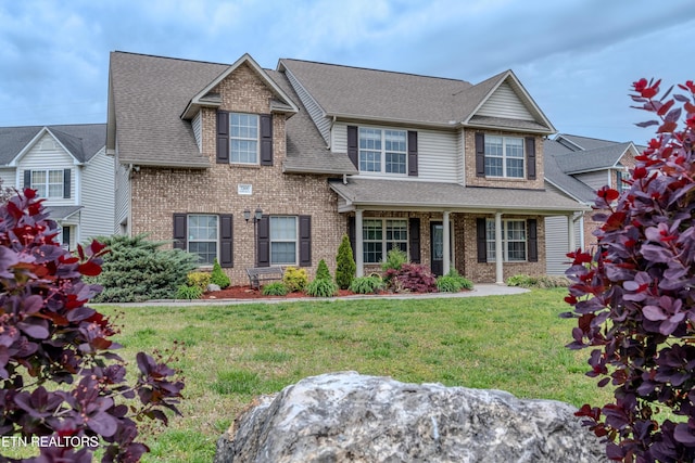 7300 Slippery Rock Ln, Knoxville, TN 37931 - view of front of home featuring brick siding, roof with shingles, and a front yard