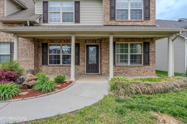 7300 Slippery Rock Ln, Knoxville, TN 37931 - entrance to property featuring brick siding, roof with shingles, and a porch