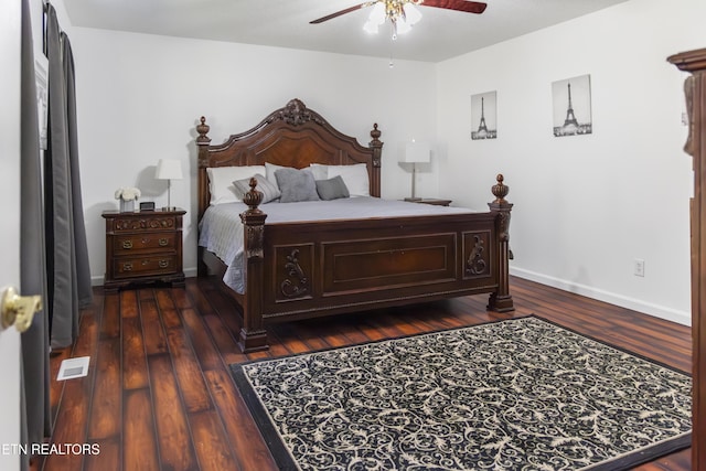 bedroom with visible vents, baseboards, a ceiling fan, and wood finished floors