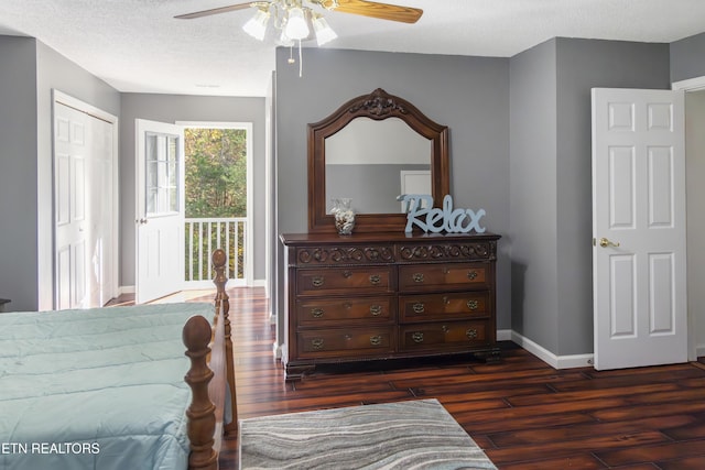 bedroom featuring a textured ceiling, access to exterior, dark wood finished floors, baseboards, and ceiling fan