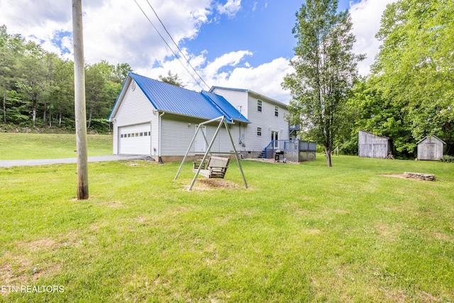 238 Dry Valley Rd, Thorn Hill, TN 37881 - view of grassy yard featuring a storage shed, driveway, and an attached garage
