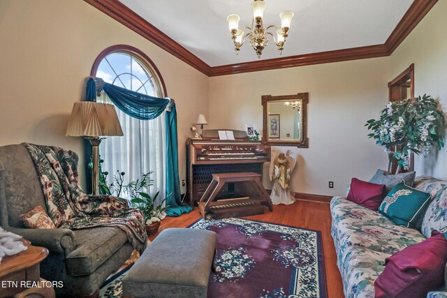 300 Lowe Rd, Huntsville, TN 37756 - living area with an inviting chandelier, baseboards, crown molding, and wood finished floors