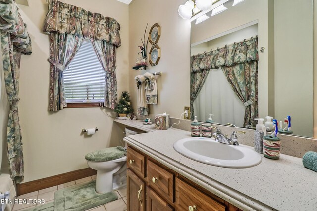 300 Lowe Rd, Huntsville, TN 37756 - full bath featuring tile patterned flooring, curtained shower, vanity, baseboards, and toilet