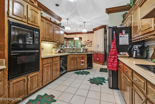 300 Lowe Rd, Huntsville, TN 37756 - kitchen featuring a sink, light countertops, light tile patterned floors, black appliances, and ornamental molding