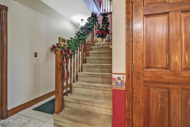 300 Lowe Rd, Huntsville, TN 37756 - stairs with baseboards and tile patterned flooring