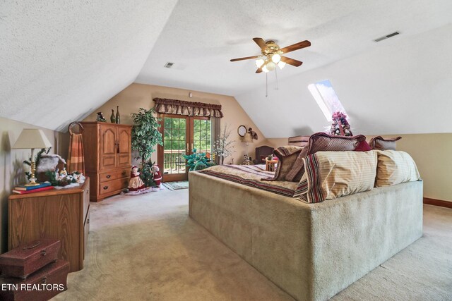 300 Lowe Rd, Huntsville, TN 37756 - living area with light colored carpet, a ceiling fan, visible vents, and lofted ceiling with skylight