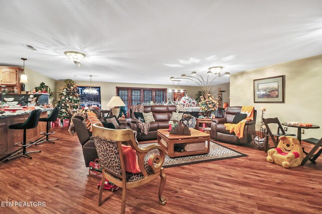 300 Lowe Rd, Huntsville, TN 37756 - living area with visible vents, wood finished floors, and a notable chandelier