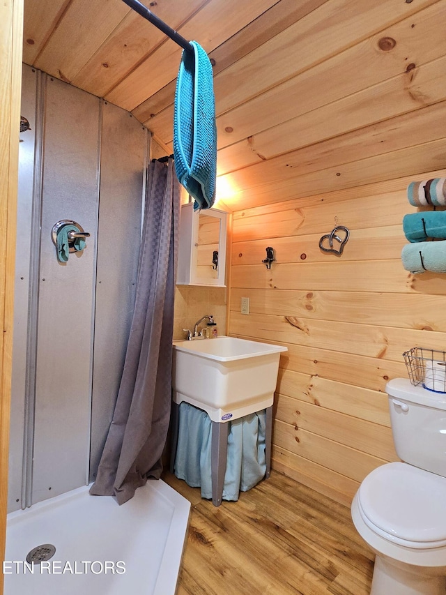 2025 Allardt Tinch Rd, Jamestown, TN 38556 - bathroom with curtained shower, toilet, wood finished floors, and wood walls