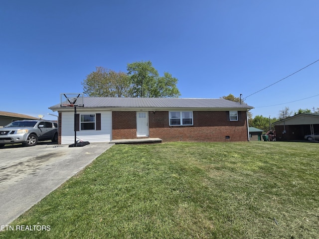 view of front of home featuring crawl space, metal roof, a front yard, and brick siding