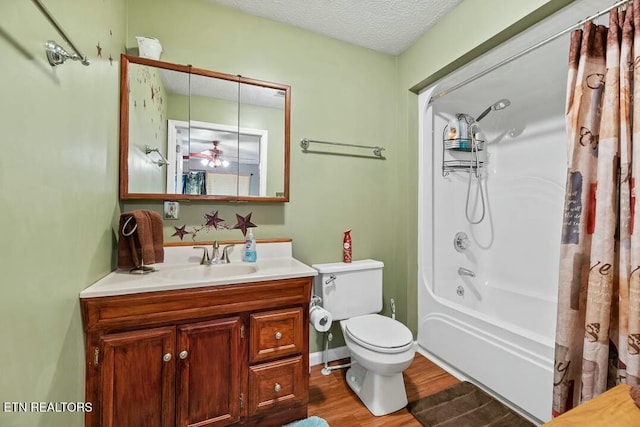 full bathroom featuring shower / tub combo, vanity, a textured ceiling, toilet, and wood finished floors