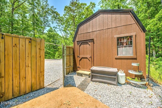 view of shed with fence