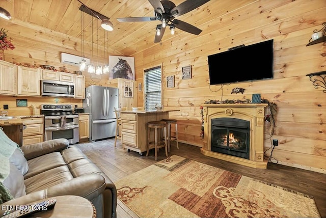 living room with wood walls, light wood-style flooring, wood ceiling, and ceiling fan