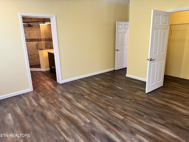 337 Costner Rd, Cosby, TN 37722 - unfurnished bedroom featuring a spacious closet, a closet, baseboards, and dark wood finished floors
