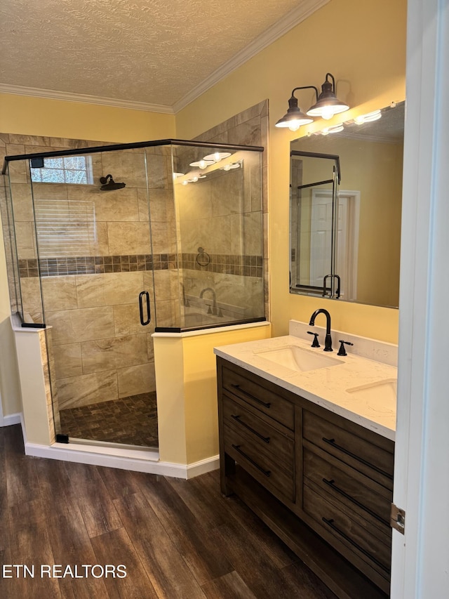 337 Costner Rd, Cosby, TN 37722 - full bath with vanity, ornamental molding, a textured ceiling, a shower stall, and wood finished floors